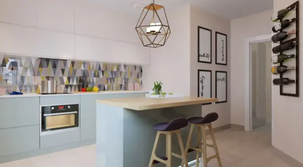 Cuisine moderne avec îlot central, tabourets et un bar à poisson mural.